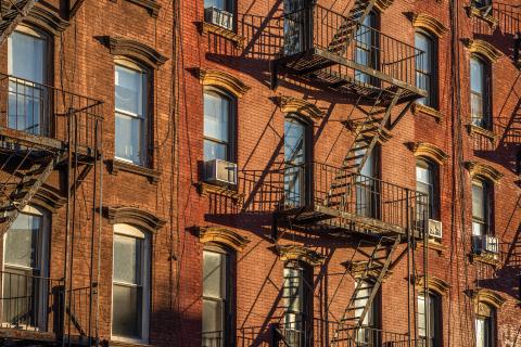 building with fire escapes and windows