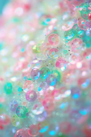Up-close photo of iridescent multi-colored sequins
