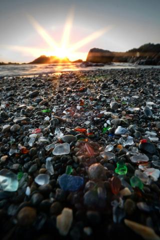 sea glass with sunset in the background